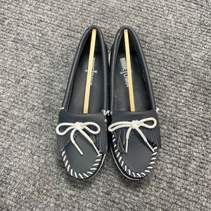 Minnetonka Black Moccasin Flats with White Lacing